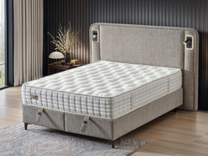 Lit complet boxspring de style chic confort deluxe en tissu beige avec tete de lit capitonnee eclairage veilleuse et liseuse collection MARVEL