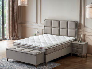 Lit boxspring haut de gamme en tissu gris avec tete de lit en damier style elegant et distingue collection FUMAT LUXE vue latérale